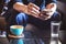 Businessman using smartphone to read investment news and reply email to confirm meeting in coffee shop. man drinking latte coffee