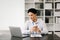 Businessman using tablet and laptop for doing math finance on an office desk, tax, report, accounting, statistics, and analytical