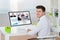 Businessman Videoconferencing On Computer
