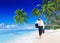 Businessman Walking Along Beach Summer Vacation Concept