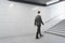 Businessman walking in contemporary metro station