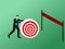 Businessman walking and push target to finish line