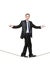 Businessman walking on a rope