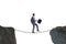 The businessman walking on tight rop in business concept