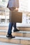 Businessman walking upward on the stair