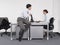 Businessman Watching Female Colleague In Office