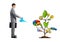 Businessman watering drawing tree with symbols