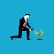 Businessman watering a plant of money. Business Investment or business vision concept