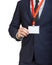 Businessman wearing a blank ID tag or name card on a lanyard at an exhibition or conference