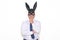 Businessman wearing a bunny mask looking pensively at the camera