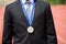 Businessman wearing gold medal