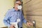 Businessman wearing protective mask for protect Coronavirus pressing button for using elevator