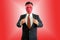 Businessman wearing red mask on red background with clipping path