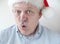 Businessman wearing Santa hat says \'Ho ho ho\'