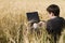 Businessman in wheat field