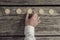 Businessman in white shirt placing five golden bitcoins in a row