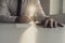 Businessman in white shirt signing document backlit by a shaft o