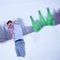 Businessman in winter forest with slingshot