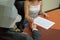 Businessman in a wolf mask signing a contract in an office - making smart decisions