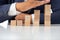 Businessman Wooden cubes on a desk in the office, Concept: Business to succeed that challenges teamwork, design development