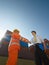 Businessman and worker with cargo containers