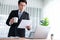 Businessman working on laptop for on office desk workspace. Jubilant