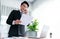 Businessman working on laptop for on office desk workspace. Jubilant