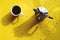 Businessman working morning with french press coffee and cup of hot coffee on yellow background. Top view, copy space, mockup.