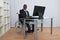 Businessman Working In Office Sitting On Wheelchair