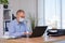 Businessman works in the office in a medical mask for coronavirus protection. New normal business practise of coronavirus covid-19