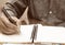 Businessman writing form filling with register on paper notebook