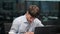 Businessman Writing on Papers at Office Desk