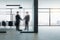 Businessmans shaking hands in contemporary office interior