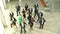 Businessmen And Businesswomen Dancing In Office Lobby