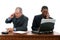 Businessmen on Cellphones at Desk