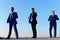 Businessmen with confident faces in formal suits