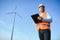 Businessmen engineering standing handsome smile front of turbine looking away