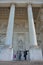 Businessmen enjoying the view at the entrance to the Church of Saint Jacques - sur- Coudenberg , place royale, Brussels .