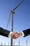 Businessmen environmental wind mill handshake
