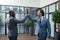 Businessmen giving high five after successful negotiation