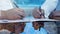 Businessmen hands signing documents on Riyadh skyline city scape background