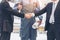 Businessmen handshake with engineer thumbs up