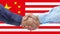 Businessmen handshaking on Usa or American and China flags merged relationship concept