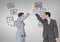 Businessmen high five with technology screens business graphics drawings