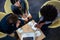 Businessmen interacting on a low table