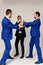 Businessmen with mad faces in formal suits on grey background.