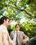 Businessmen meeting around car.