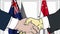 Businessmen or politicians shake hands against flags of Australia and Singapore. Official meeting or cooperation related