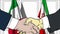 Businessmen or politicians shake hands against flags of Italy and Iran. Official meeting or cooperation related cartoon