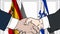 Businessmen or politicians shake hands against flags of Spain and Israel. Official meeting or cooperation related